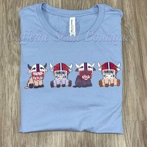 Bella Canvas Light Blue Short Sleeve Tee with football team highland cows
